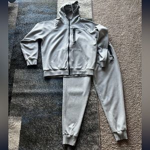 Grey Nike tech suit